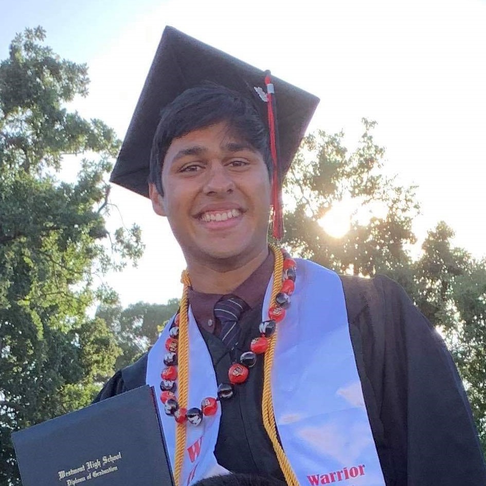 High-school graduate in cap and gown