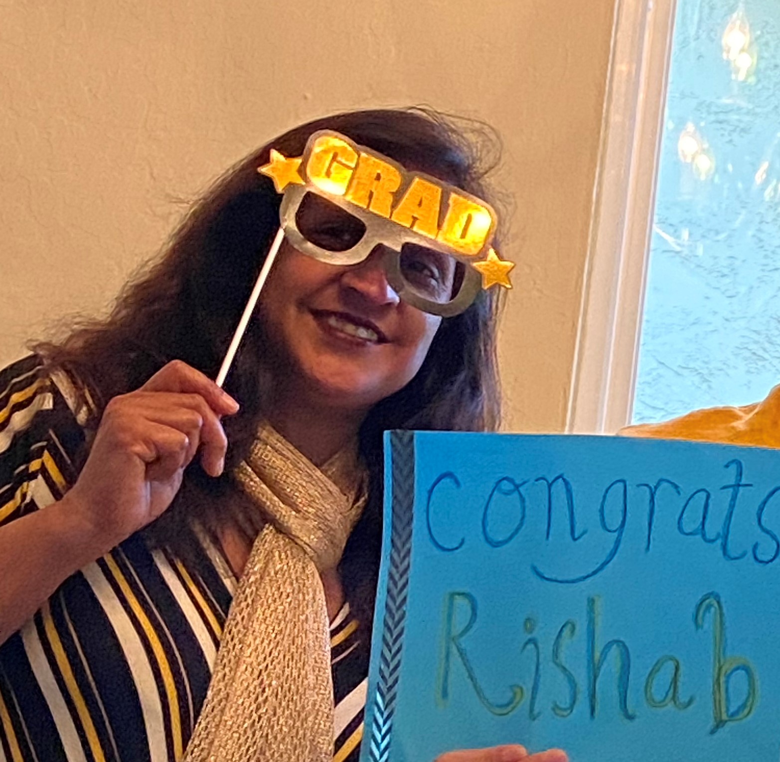 Ruchi celebrating a student's graduation